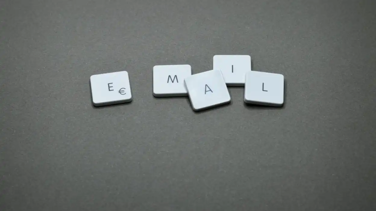 A/B testing for email copy 1 Close-up of the word 'email' formed with letter tiles on a gray surface.